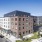 Exterior of our apartments for rent at The Brookliner in Boston featuring Whole Foods and CVS next door.