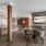 Luxury community lounge with a dual sided fireplace, entertainment kitchen, table with four seats, and tv