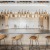 Entertainment kitchen with four barstools, gold pendant lighting and an oversized kitchen island