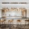 Entertainment kitchen with four barstools, gold pendant lighting and an oversized kitchen island