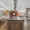 Community lounge at The Brookliner in Boston with a marble kitchen island for entertainment, ample seating areas and dual sided fireplace.